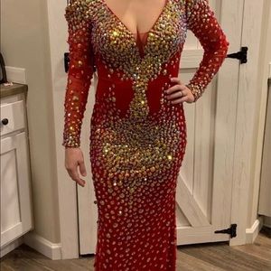Beautiful red elegant gown with gold beading.